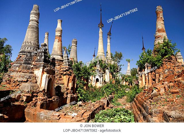 Myanmar, Shan, Shwe Inn Thein. The abandoned and overgrown pagodas of Inn Thein in Myanmar