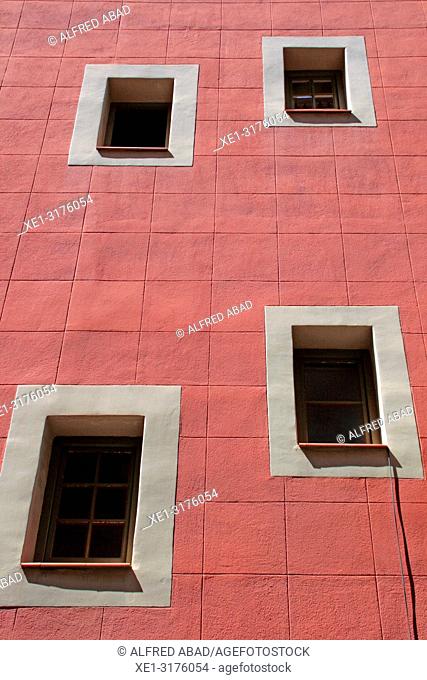 windows in red wall, district of Gracia, Barcelona, Catalonia, Spain