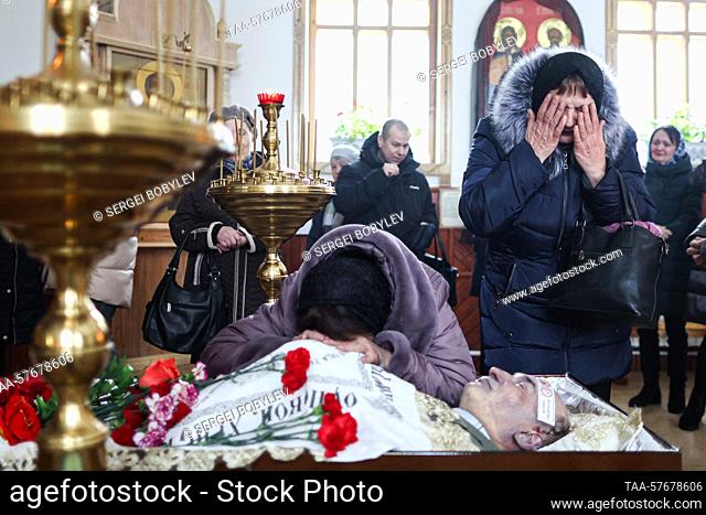 RUSSIA, BRYANSK REGION - MARCH 4, 2023: Widow Tamara (C) mourns during the funeral of Leonid Golovanov killed in a Ukrainian sabotage attack