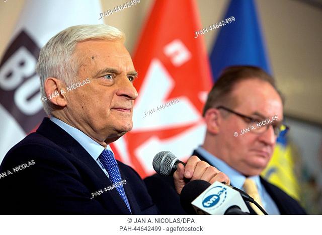 Polish politicians Jerzy Buzek (L) and Jacek Saryusz-Wolski speak as representatives of a group of members of the European of parliament (MEP) during a press...