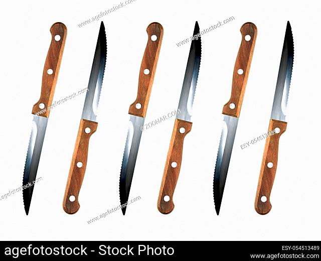 Steak knives isolated against a white background