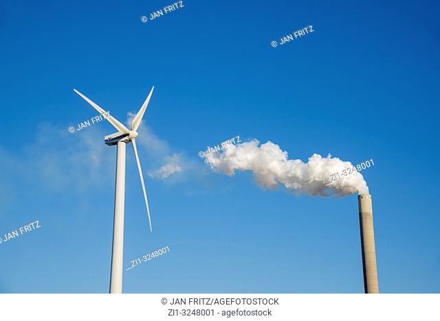 smoking pipe from powerplant, windmill, blue sky