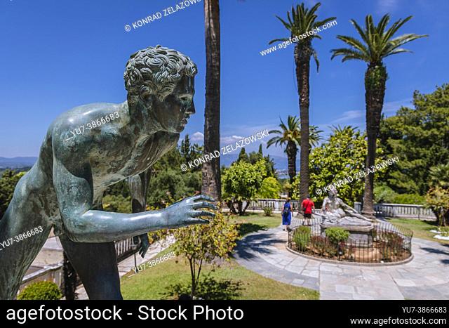 Bronze statue on a terrace of Achilleion palace built in Gastouri on the Corfu Island, Greece, Dying Achilles statue on background