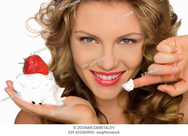 Smiling woman with strawberries and cream