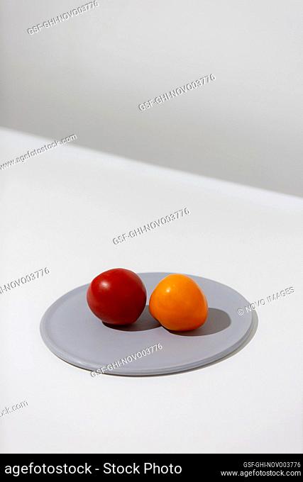 Red and Orange Tomatoes on Grey Plate