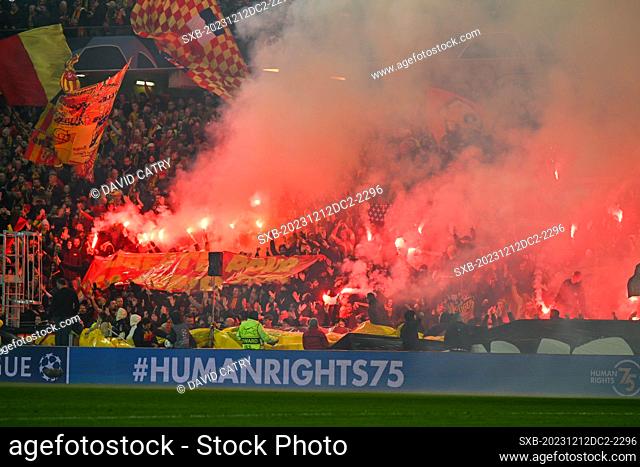 fans and supporters of Lens using Pyrotechnical flares and fireworks during the Uefa Champions League matchday 6 game in group B in the 2023-2024 season between...