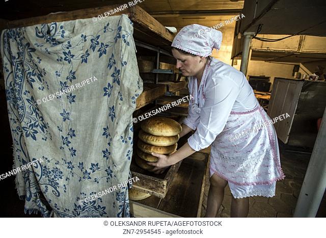 Workers of the Nikitin Kolkhoz bakery prepare bread, Ivanovka village, Azerbaijan. Bakery makes bread for local people. Children from school and kindergarden of...