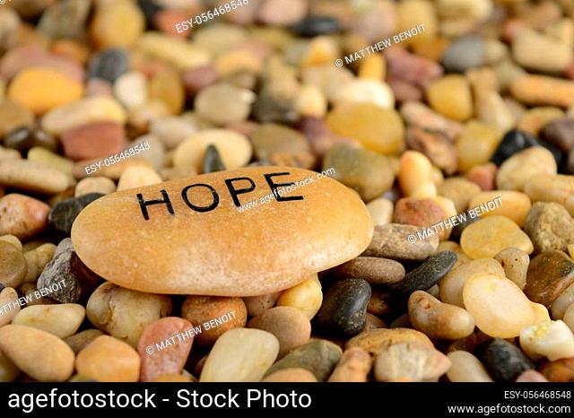 A stone with the word Hope engraved on it for affirmation purposes