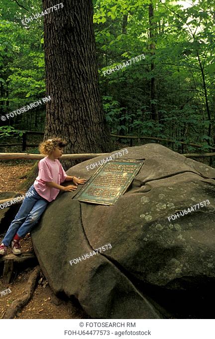 Nantahala National Forest, NC, North Carolina, Nine year old girl reads the plaque on boulder dedicating Joyce Kilmer Memorial Forest