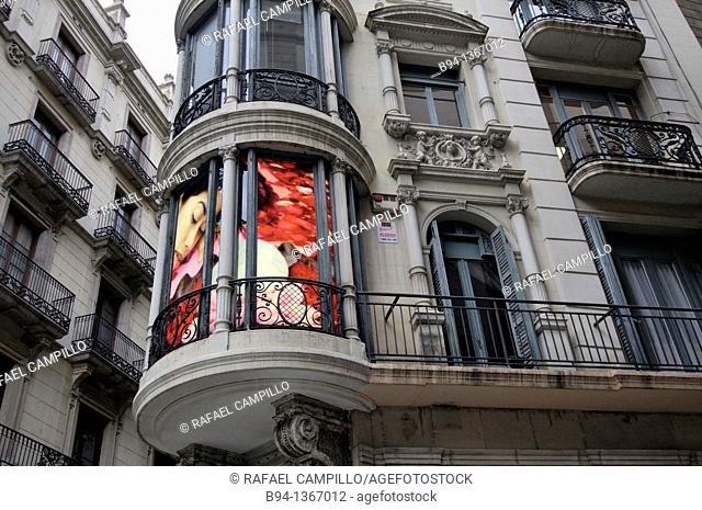 Advertising in a balcony on the corner between Canuda and Santa Anna streets, Ciutat vella district, Barcelona, Catalonia, Spain