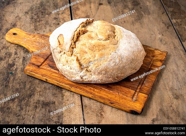 Wheat bread on a wooden rustic table