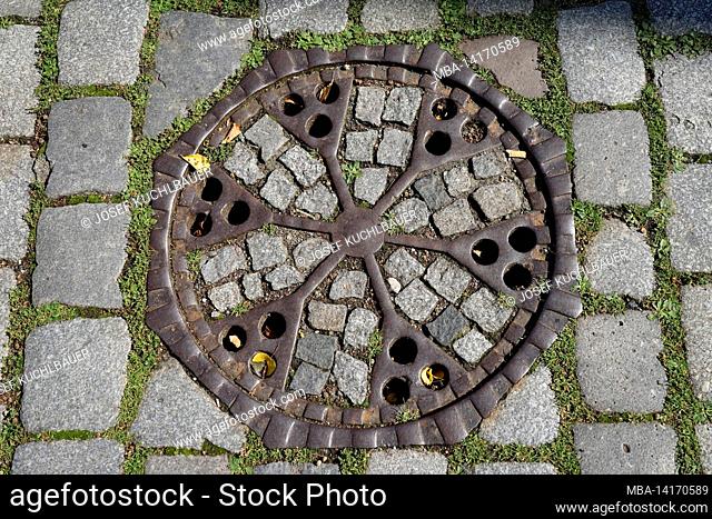 germany, bavaria, upper franconia, bamberg, old town, stone pavement, historical manhole cover