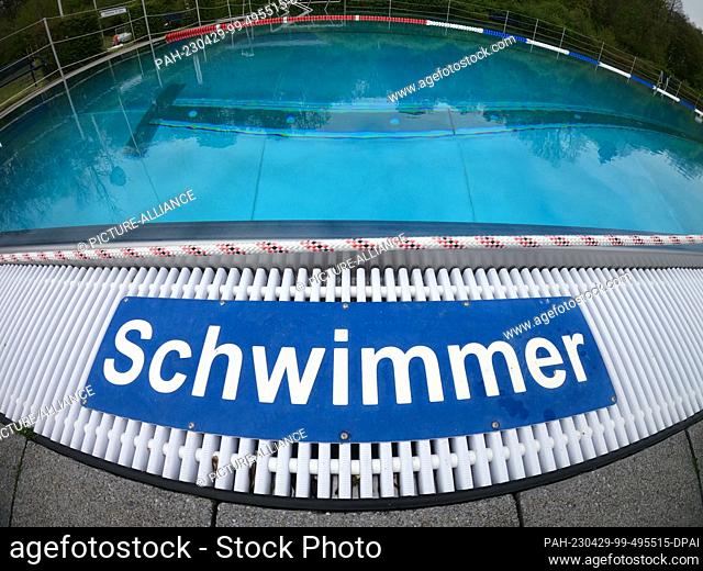 28 April 2023, North Rhine-Westphalia, Paderborn: ""Swimmer"" is written on the edge of the pool at the Rolandsbad outdoor pool at the start of the outdoor pool...