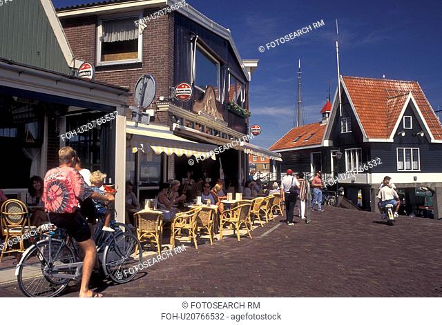 Volendam, Netherlands, Holland, Noord-Holland, Europe, Outdoor cafT on the waterfront of the harbor on Markermeer in the town of Volendam