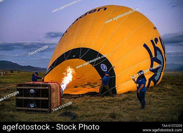 ARMENIA, STEPANAVAN - AUGUST 26, 2023: Participants launch a hot air balloon during the Air Fest IV Stepanavan featuring planes, helicopters, skyballs