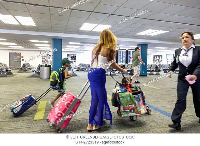 Florida, Miami, Miami International Airport, MIA, aviation, terminal, concourse, gate, passenger, traveler, Hispanic, woman, boy, luggage, walking, employee