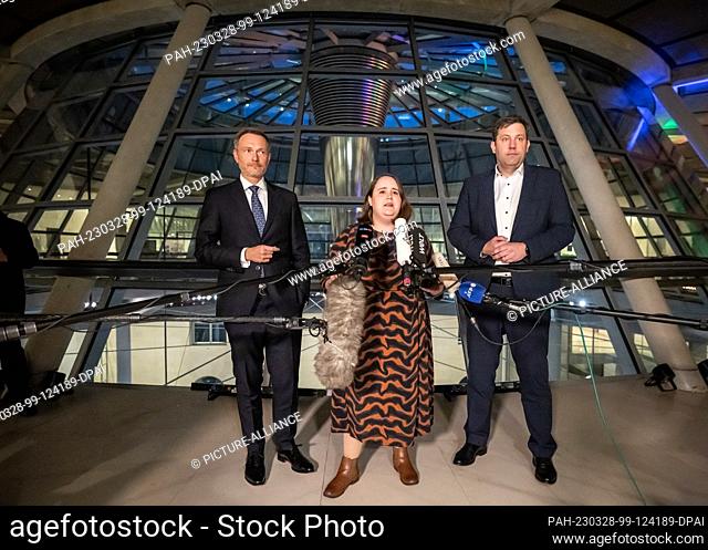 28 March 2023, Berlin: The leaders of the coalition parties Lars Klingbeil (SPD) Ricarda Lang (Greens) and Christian Lindner (FDP) speak in the Bundestag after...