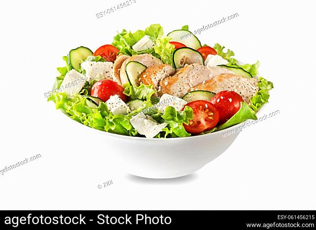Fresh green salad with chicken breast feta cheese and tomato isolated on white background