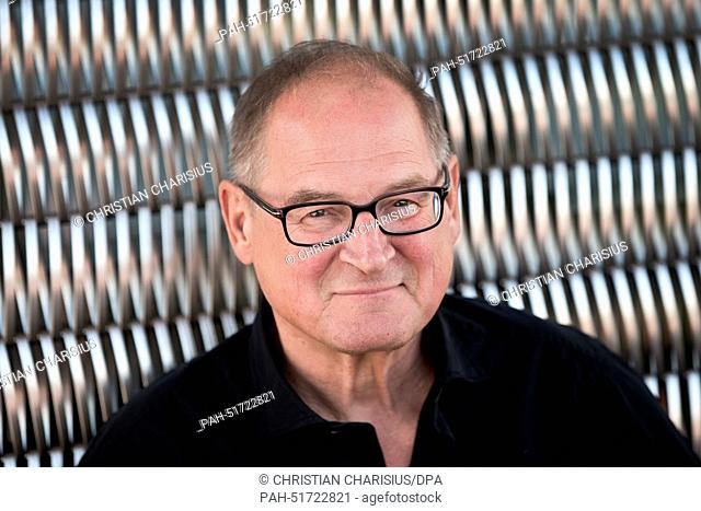 dpa-Exclusive - Looks at the photographer's lens in Hamburg, Germany, 28 August 2014. Mr. Klaussner will celebrate his 65th birthday on 13 September 2014