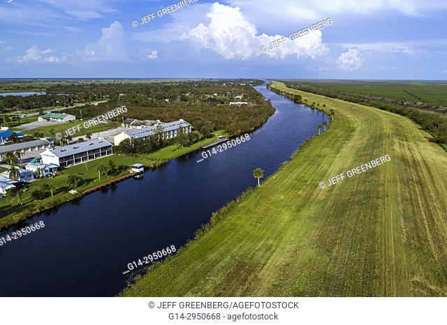 Florida, Lakeport, water, canal, Lake Okeechobee levee Herbert Hoover dike, canal, Lakeport Motel And Restaurant, aerial overhead bird's eye view above