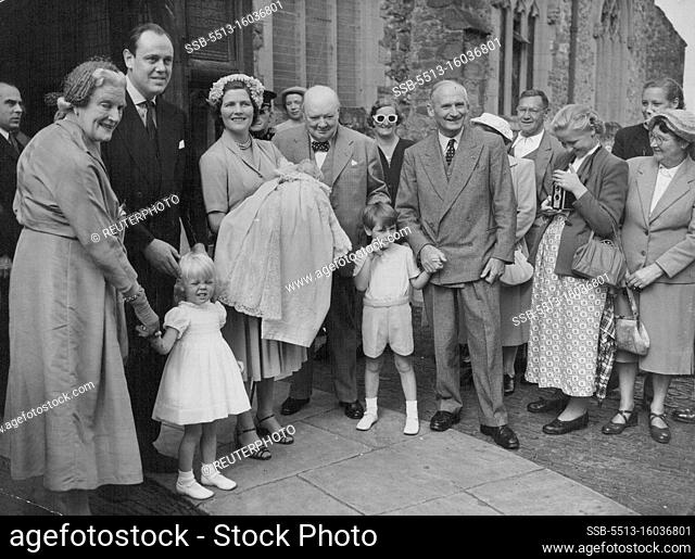 A Churchill Grandchild Is christened -- British Premier Winston Churchill beams happily with his family after the christening of his eighth grandchild