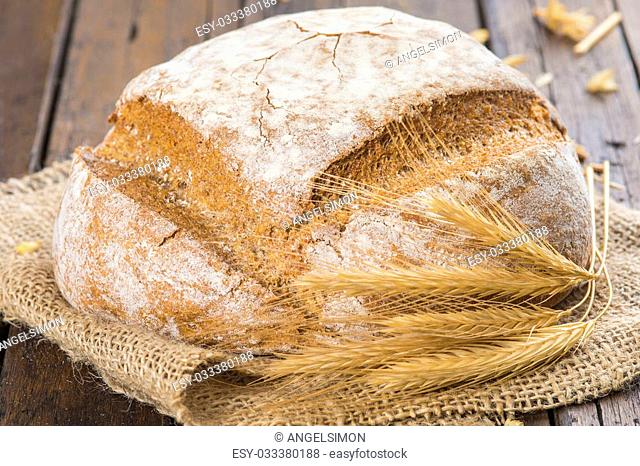 Homemade multigrain sourdough bread on a wooden table