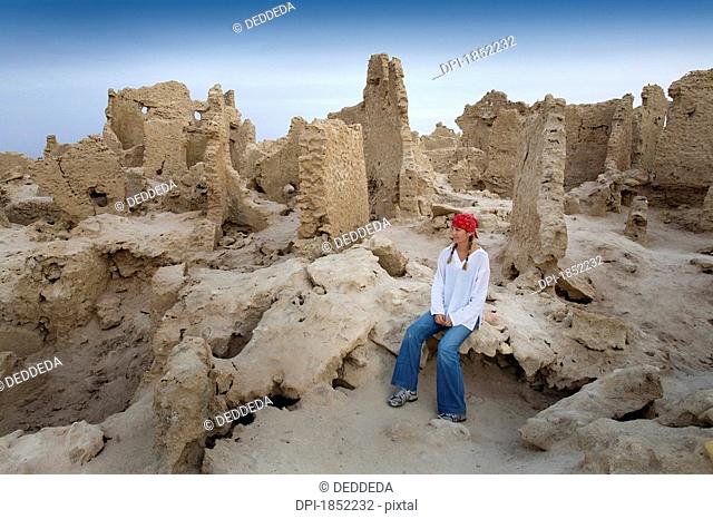 Siwa Town, Siwa Oasis, Egypt, Africa, Tourist enjoys mud brick fortress of Shali