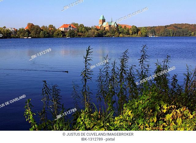 Ratzeburg Domsee lake with the Ratzeburger Dom cathedral and the former mansion, now county museum, on the Dominsel island, Kreis Herzogtum Lauenburg district