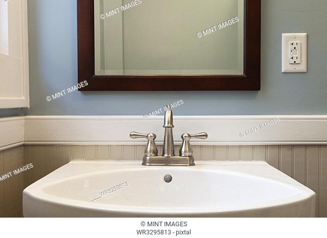 Sink and mirror in bathroom