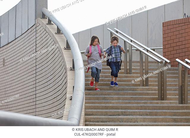 Children climbing stairs outdoors