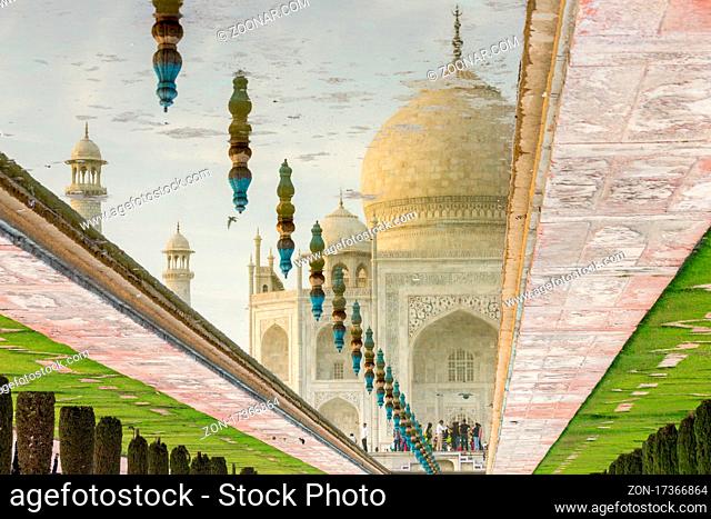 Taj Mahal reflected in the water channel on a March afternoon. The famous mausoleum has been built by the Mughal emperor of India Shah Jahan (Muhammad Khurram)