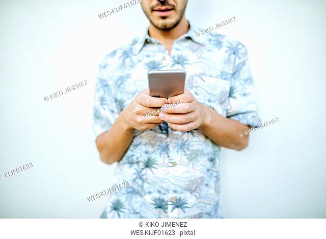 Close-up of man holding cell phone