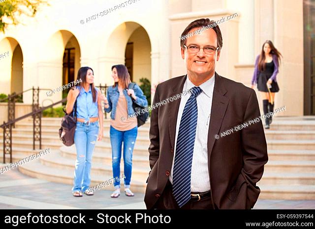 Male Adult Administrator In Suit and Tie Walking on Campus