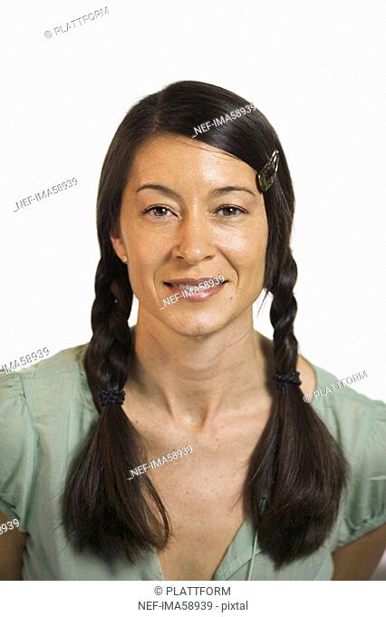 Portrait of a smiling woman with braids