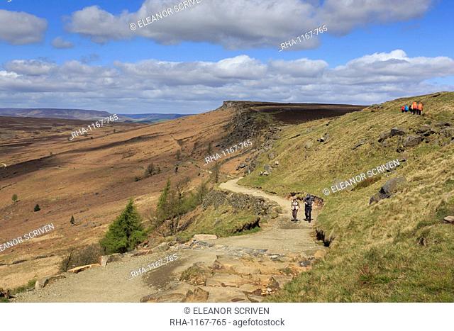 Walkers, Stanage Edge, on a fine spring day, near Hathersage, Peak District National Park, Derbyshire, England, United Kingdom, Europe
