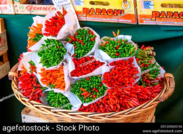 Red and green chilies at traditional market in Italy