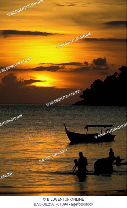 A beach at sundown with Pantai Tanjung Rhu in norden of the island Langkawi in Malaysia in southeast Asia