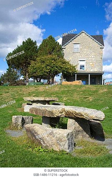 Stone bench in front of a house, Home of artist Fitz Hugh Lane, Fitz Hugh Lane Park, Gloucester, Massachusetts, USA