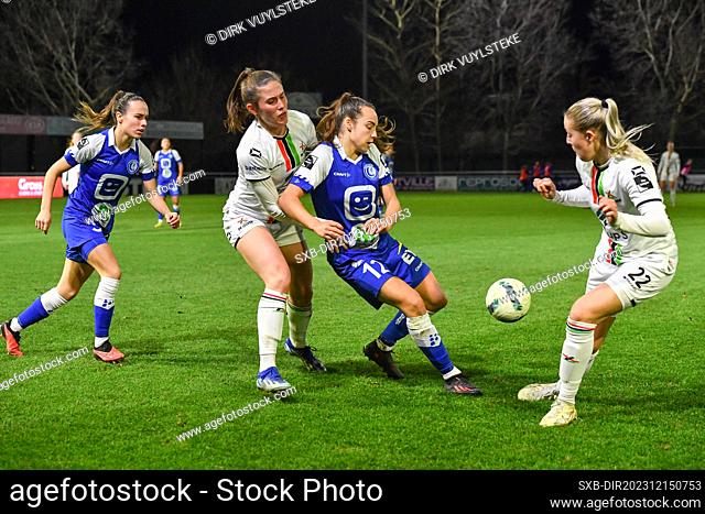 Marie Detruyer (8) of OHL and Saar Janssen (22) of OHL with Gaelle Nierynck (3) of AA Gent Ladies and Jasmien Mathys (12) of AA Gent Ladies pictured during a...