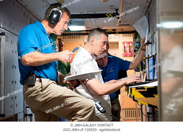 NASA astronaut Dan Burbank (foreground), Expedition 29 flight engineer and Expedition 30 commander; and Russian cosmonauts Anatoly Ivanishin and Anton...