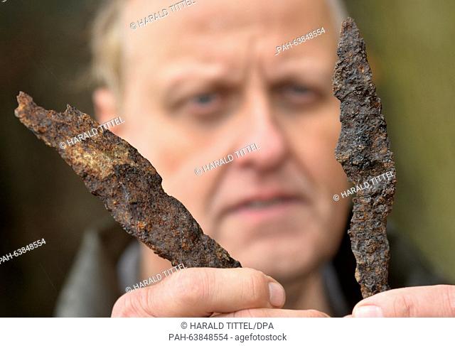 State archeologist with the General Directorate for Cultural Hertiage (GDKE) of Rhineland-Palatinate, Axel von Berg, presents two spearheads - remains from a...