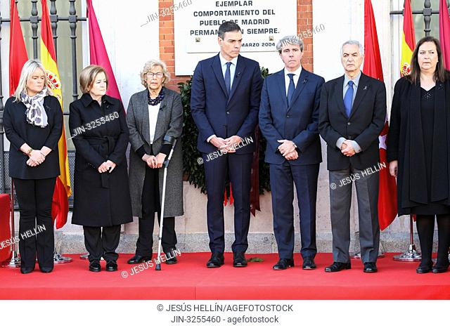Angel Garrido(R), Pedro Sanchez(C), Manuela Carmena(L) and member of the foundations AVT seen attending the floral offering in the event of tribute to the...