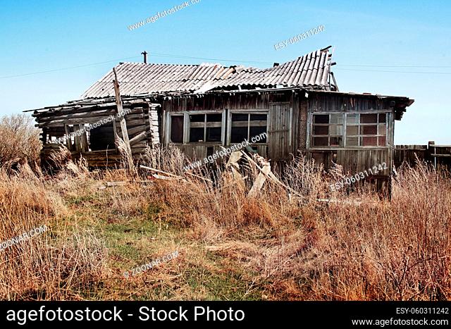 old wooden thrown destroyed house
