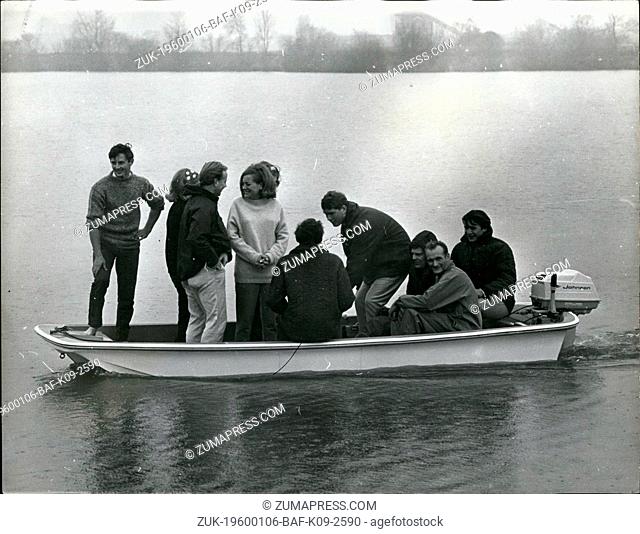 1972 - Testing the unsinkable Dory: Eight employees of a boat-building firm of Chichester, Sussex, and two models hired for the day yesterday tested the...