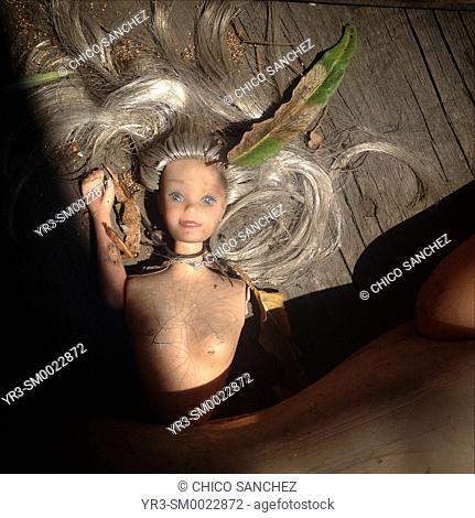 A blonde barbie with blue eyes is displayed in the Island of the Dolls, Xochimilco, Mexico City, Mexico
