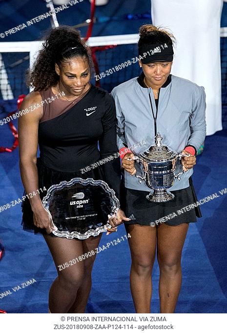 September 8, 2018 - Flushing Meadows, New York, U.S - (L) US Open champion Naomi Osaka and Serena Williams pose with their trophy during the award presentation...