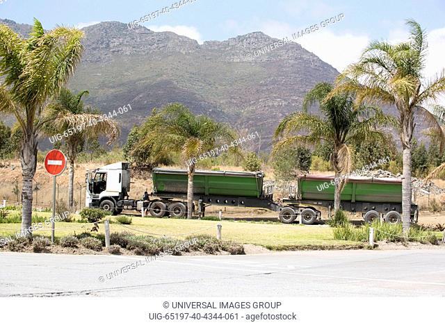 Riebeek West Western Cape South Africa, Haulage truck carrying a load of cement being checked by the driver
