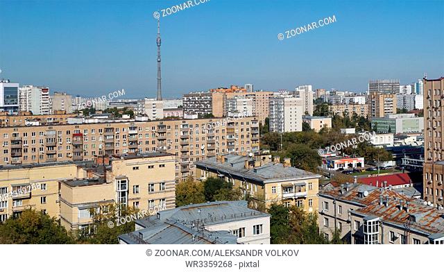 RUSSIA , MOSCOW- SEPTEMBER 23, 2017: Unknown rusty roofs of the central residential area of the Russian capital. In the background - the highest television...