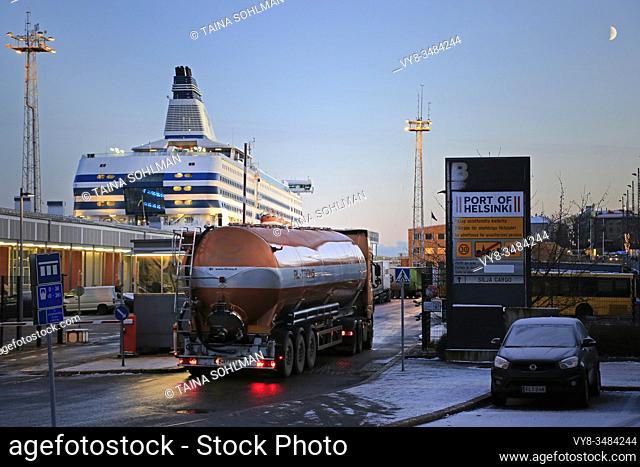 RL-Trans truck in front of tank trailer enters Silja Cargo at South Harbour ferry terminal on a winter evening in Helsinki, Finland. December 3, 2019