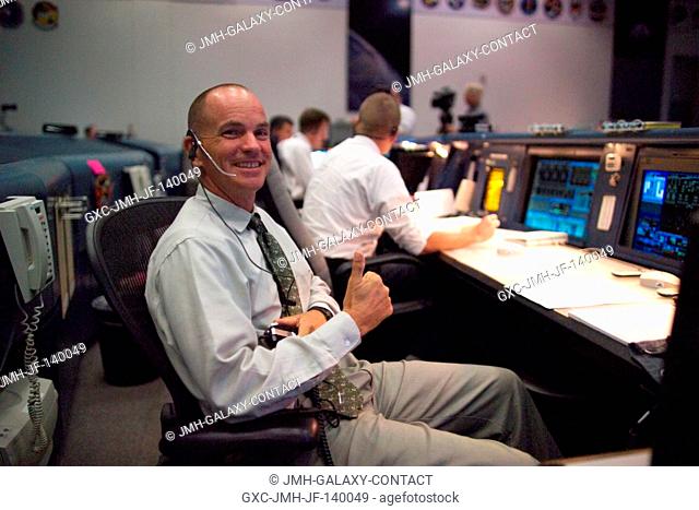 Astronaut Frederick W. (Rick) Sturckow, weather expert at the spacecraft communicator (CAPCOM) console in the Shuttle (White) Control Room of Houston's Mission...